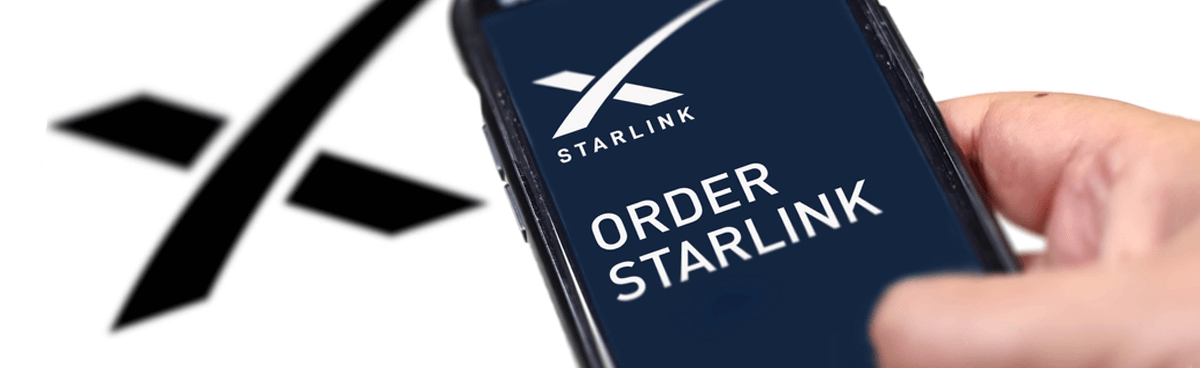 Hand using mobile phone to order Starlink internet