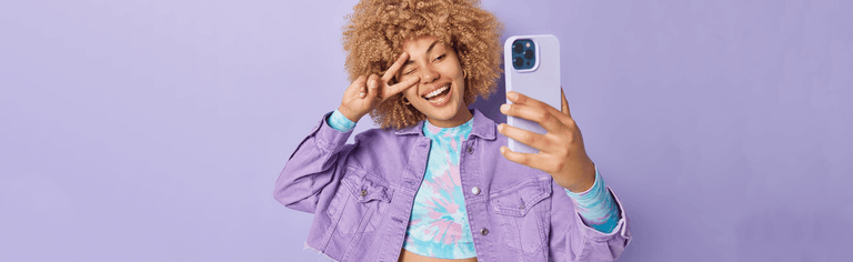 Happy woman using purple phone