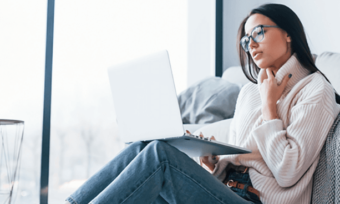 Woman using laptop at home