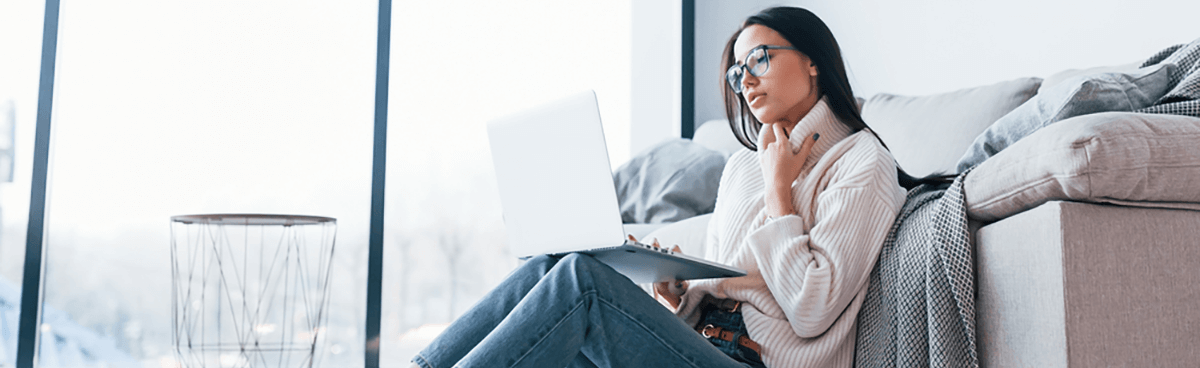 Woman using laptop at home