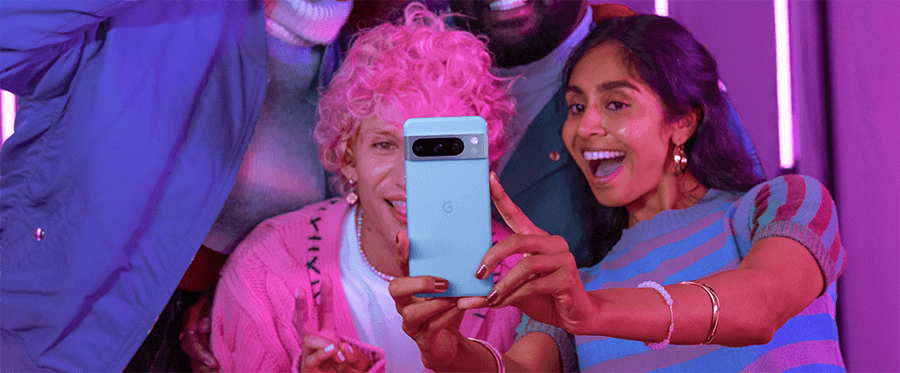 Friends taking selfie with blue Pixel phone