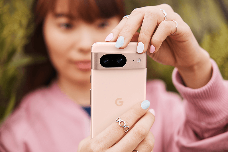 Rose pink Pixel 8 phone in woman's hands