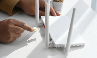 Closeup of man configuring modem. Modem setup guide