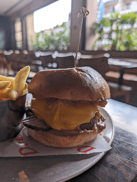 Indoor photo of burger taken on Pixel 8