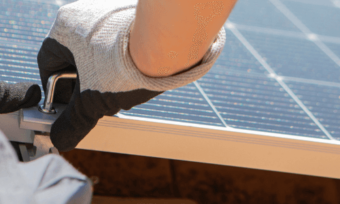 solar panel installer checking roof