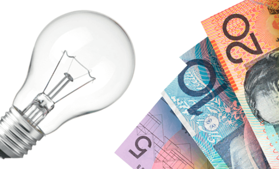 Australian bank notes next to a light bulb