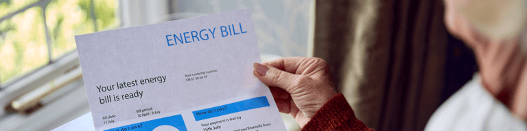 woman holding energy bill