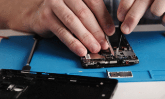 Technician refurbishing phone