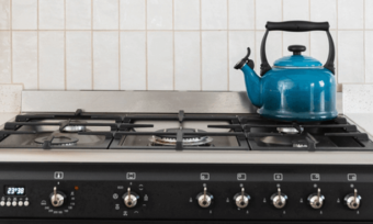 Installed gas kitchen with blue kettle
