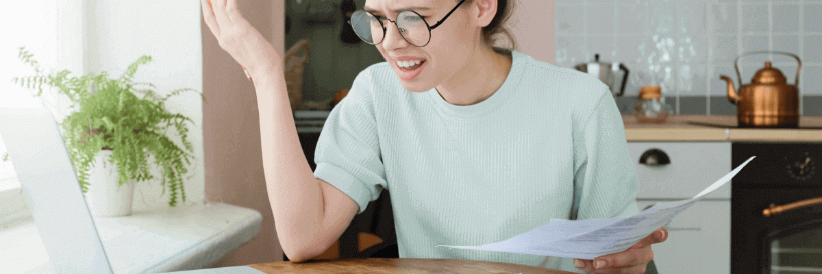 Confused person reading expensive bill