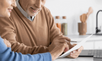 Older couple reading bill