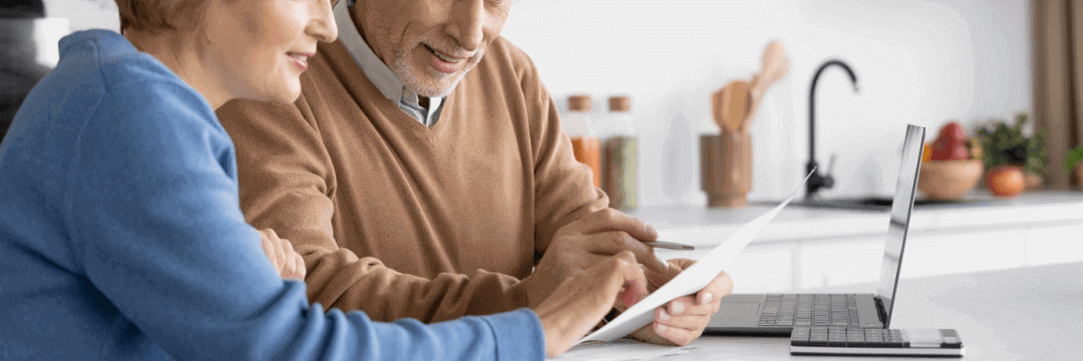 Older couple reading bill