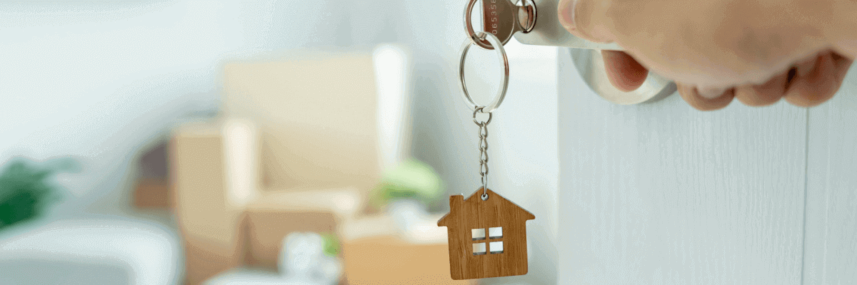 House keys opening door