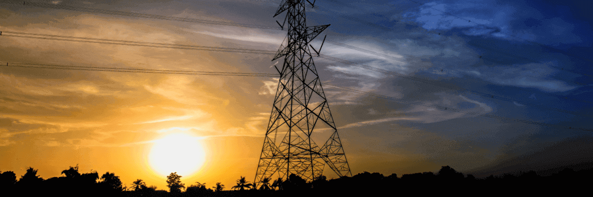 Power poles and lines with sunset