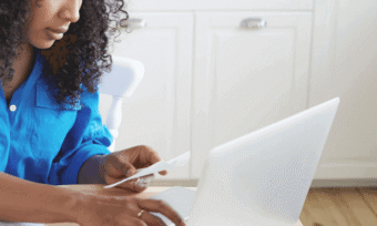 Woman reading bill. Electricity deregulation.