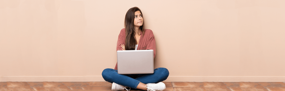 NBN price changes July 2025. Concerned woman using laptop