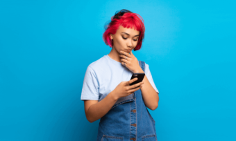 Disappointed young woman using phone. Telstra price change concept