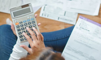 Woman budgeting with bills