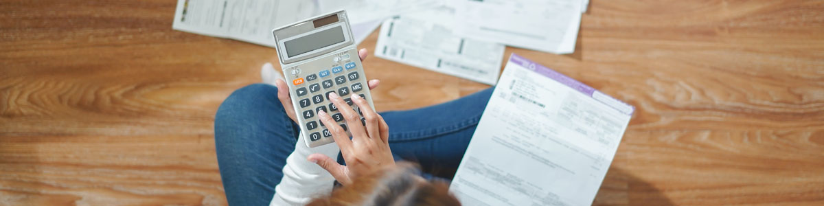Woman budgeting with bills