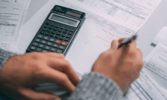 Homeowner paying electricity bill. Energy costs in VIC