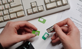 Person holding lots of SIM cards