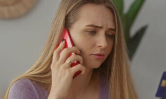 Woman on phone stressed about finances